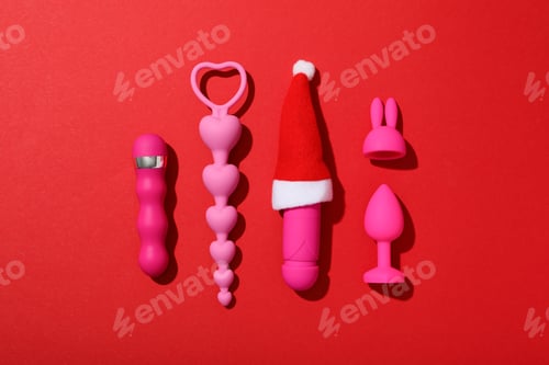 Preview: Sex toys with Christmas Santa hat, top view.