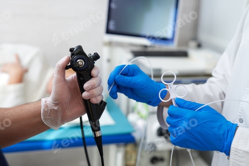 Preview: doctor puts a plaster on the arm of a patient in the hospital with a broken arm