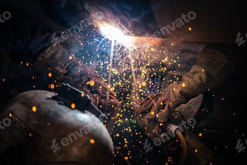 Preview: Person welding at a construction site