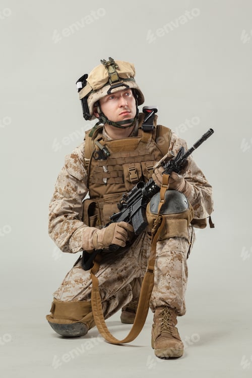 Preview: Soldier in military gear holding rifle during training session in indoor environment