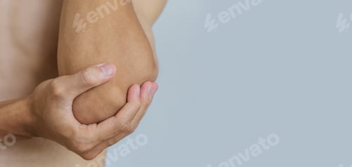 Preview: Young man suffering with elbow pain.Office syndrome Concept.Health concept.copy space for text.