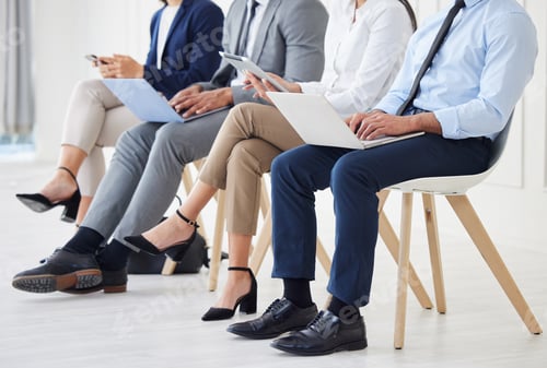 Preview: Unknown group of diverse businesspeople waiting for interview and using technology. Team of applica