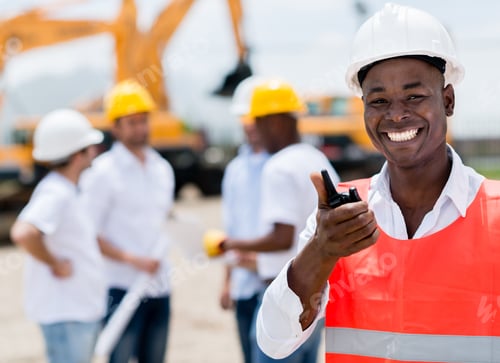 Preview: Construction Worker Talking On A Radio And Looking Happy