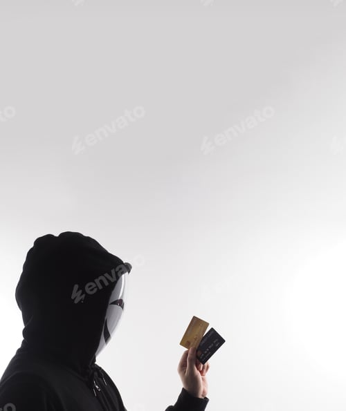 Preview: Credit cards personal data stolen by anonymous man in Black hood shirt.