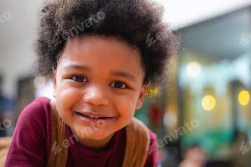 Preview: African American boy with afro hair looking at camera