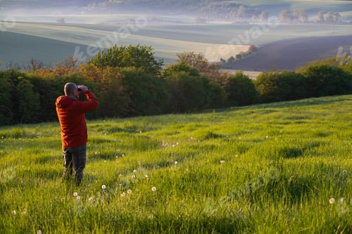 Preview: Man enjoying gorgeous rural landscape in South Moravia region, Czech Republic