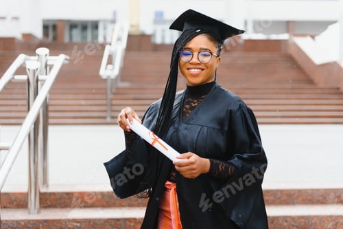 Preview: happy african american female student with diploma at graduation