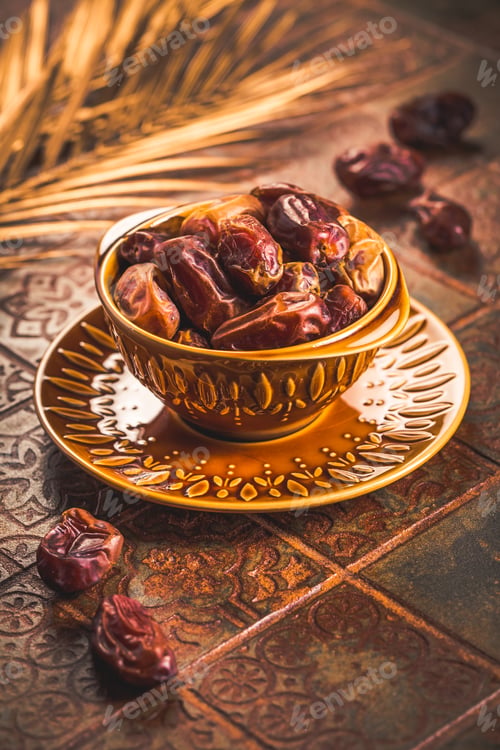 Preview: Dried dates in bowl on old kitchen table