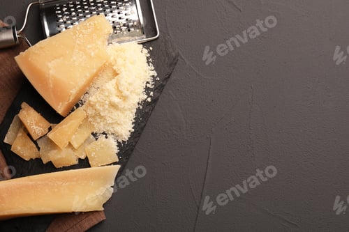 Preview: Delicious parmesan cheese on grey background, top view. Space for text