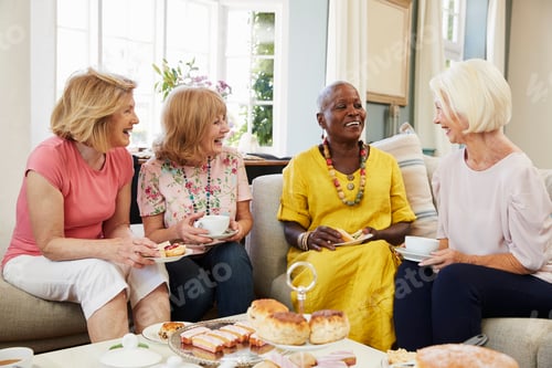Preview: Senior Female Friends Enjoying Afternoon Tea At Home Together