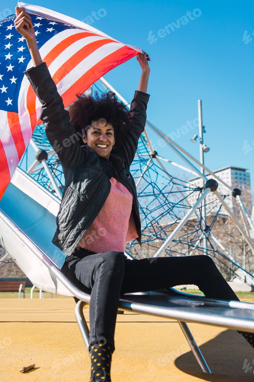 Preview: black woman with afro hair and an american flag.