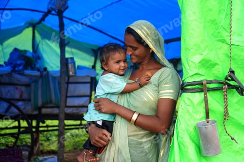Preview: Nomadic tribe woman with baby at the tent, India.