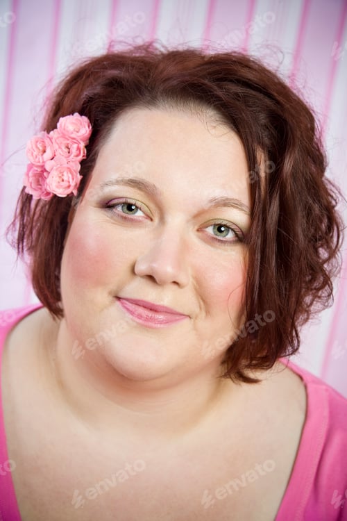 Preview: Portrait of smiling woman wearing pink flowers