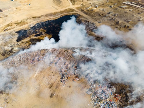 Preview: Aerial view of landfill with burning trash piles