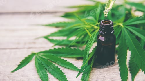 Preview: Cannabis extract in a small bottle. Selective focus.