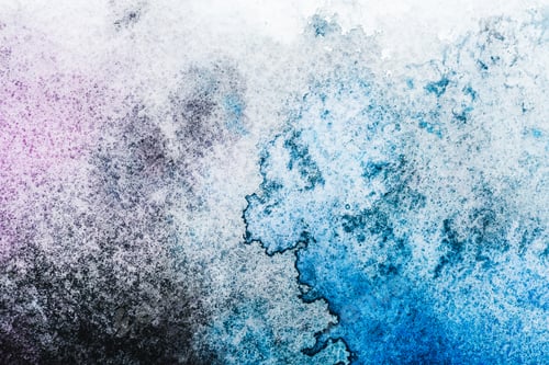 Preview: top view of blue and grey watercolor spills on white paper