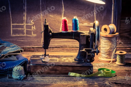 Preview: Vintage tailor workshop with sewing machine, cloth and scissors