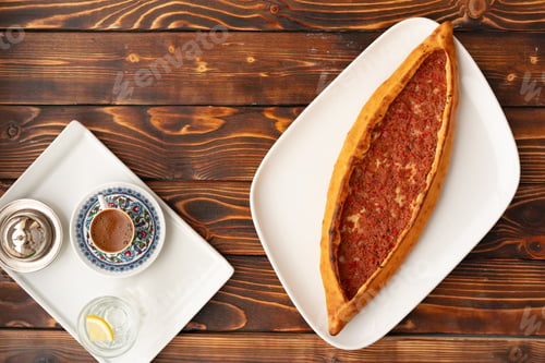 Preview: Pide - Turkish baked bread on wooden table