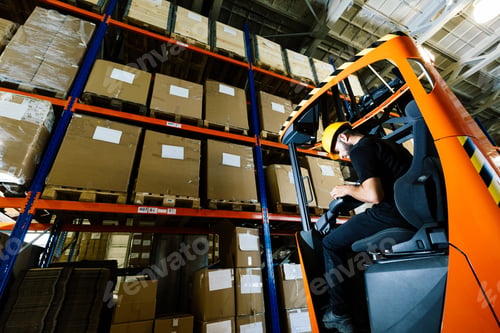 Preview: Warehouse worker doing logistics work with forklift loader
