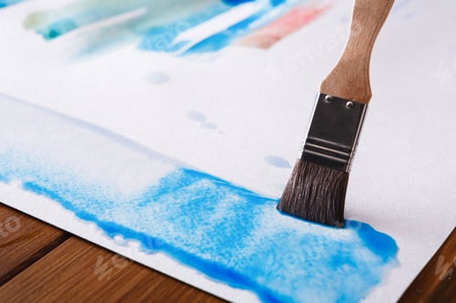 Preview: Close up of Blue Watercolor Painting with Brush