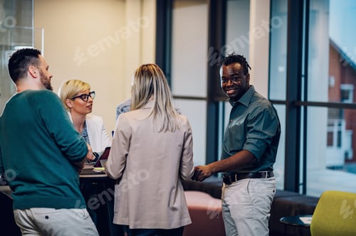 Preview: Multiracial business team working together and having a meeting in the office