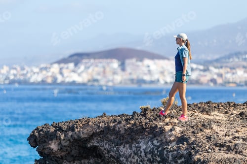 Preview: Young woman enjoying summer vacation near ocean
