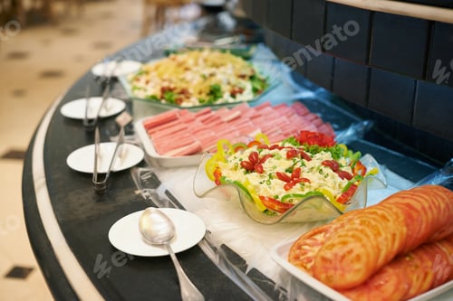 Preview: Pick your dish. A selection of dishes on a rotating buffet counter.