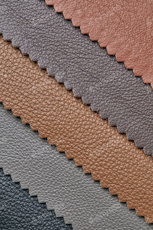 Preview: Samples of beige, brown, gray black leather. Leather crafts and craftwork. View from above.