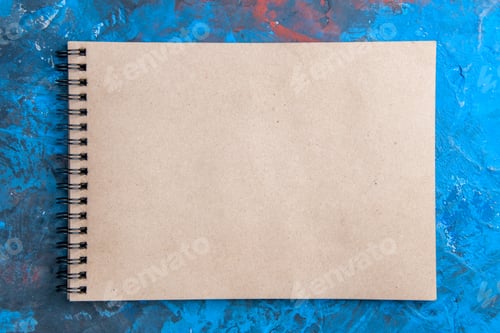 Preview: top view a notepad on blue red background