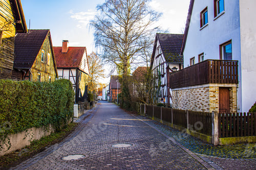 Preview: houses on European street, the road is paved with paving stones, Germany