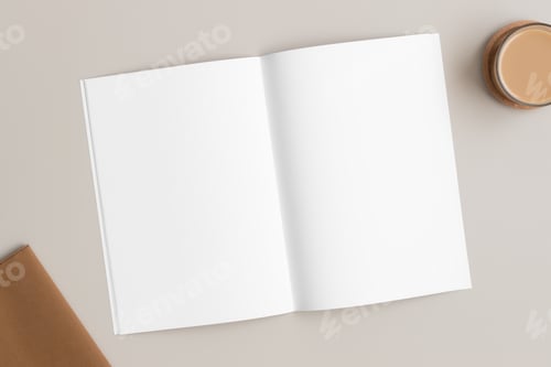 Preview: Open magazine mockup with a cup of coffee and a notebook on the beige table.