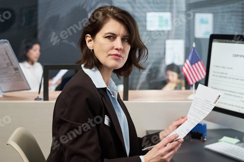 Preview: Portrait of Middle Aged Woman Processing Documents at Visa Center