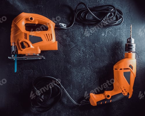 Preview: Orange Power Tools on a Dark Textured Surface