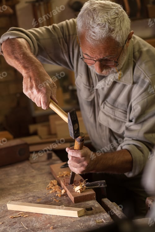 Preview: Experienced carpenter working in his workshop.