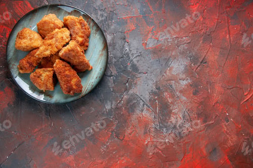 Preview: top view tasty chicken wings inside plate on dark surface dinner burger food fries meat lunch