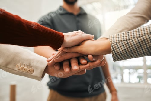 Preview: Group of businesspeople with hands stacked. Corporate professionals giving each other motivation. C
