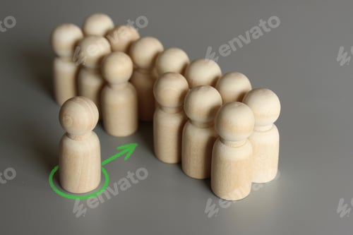 Preview: Selective focus image of one wooden doll join the group