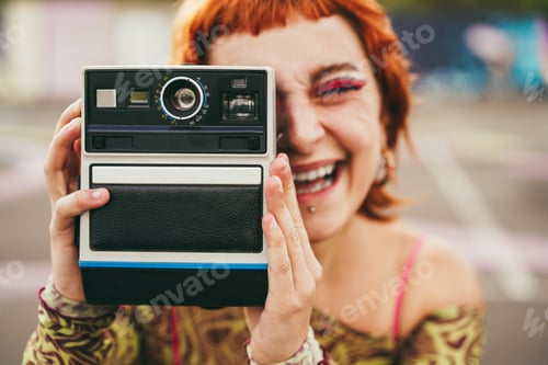 Preview: Young girl using vintage old camera outdoor - Focus on hands holding cam
