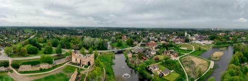 Preview: 180 degree aerial panorama of Dobele city, in the foreground medieval castle ruins and river, Latvia