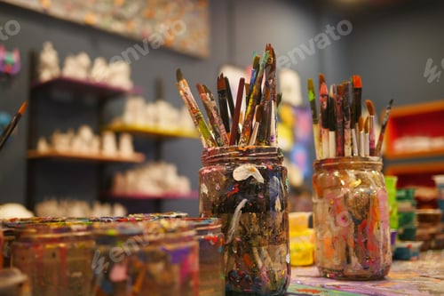 Preview: Paints and paint brushes in an artists studio.