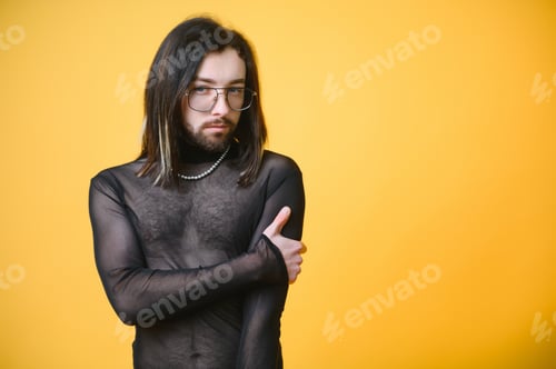 Preview: Portrait of a gay man on a colored background. Gender equality.