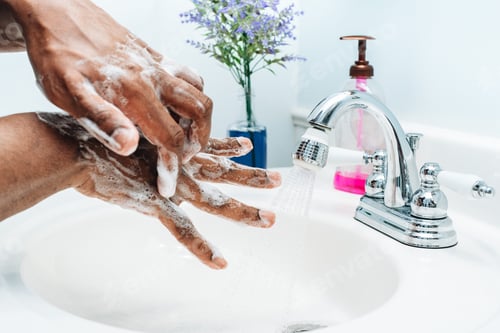 Preview: Washing hands, African American or black man at home practicing good hygiene