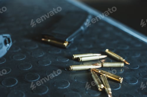 Preview: close up view of bullets and rifle magazine on table