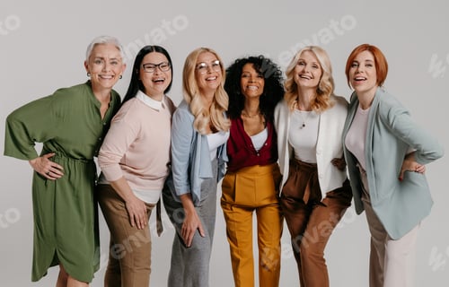 Preview: Multi-ethnic group of happy mature women bonding against grey background
