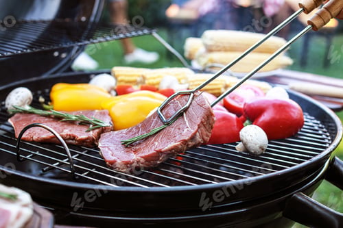 Preview: Barbecue grill with meat and vegetables outdoors, closeup