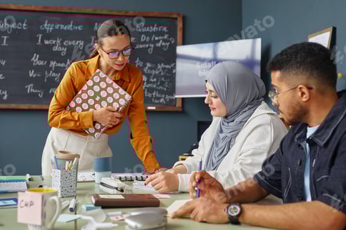 Preview: Young Caucasian Woman Teaching Diverse Young Adults during Language Lesson