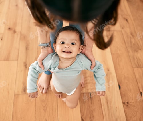 Preview: I can do anything with mom by my side. Shot of an adorable baby learning to take her first steps.