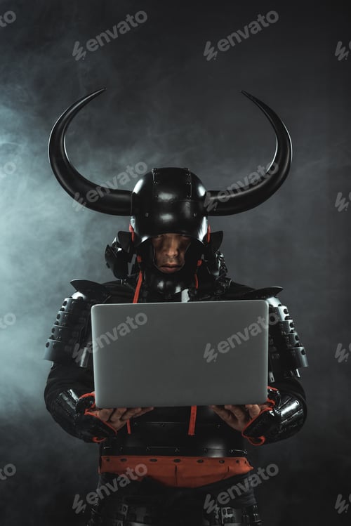 Preview: armored samurai warrior using laptop on dark background with smoke