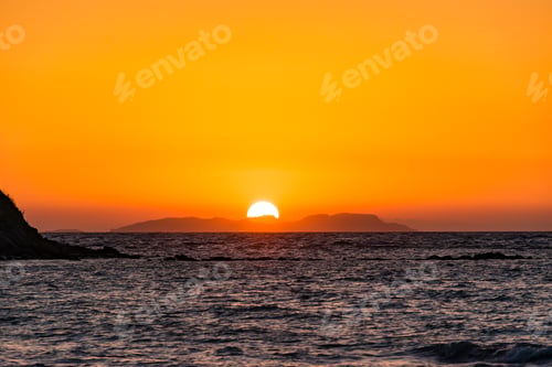 Preview: Mesmerizing view of a beautiful seascape during a scenic sunset in Corfu, Greece