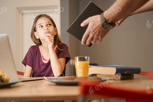 Preview: Girl using laptop and looking at screen at home